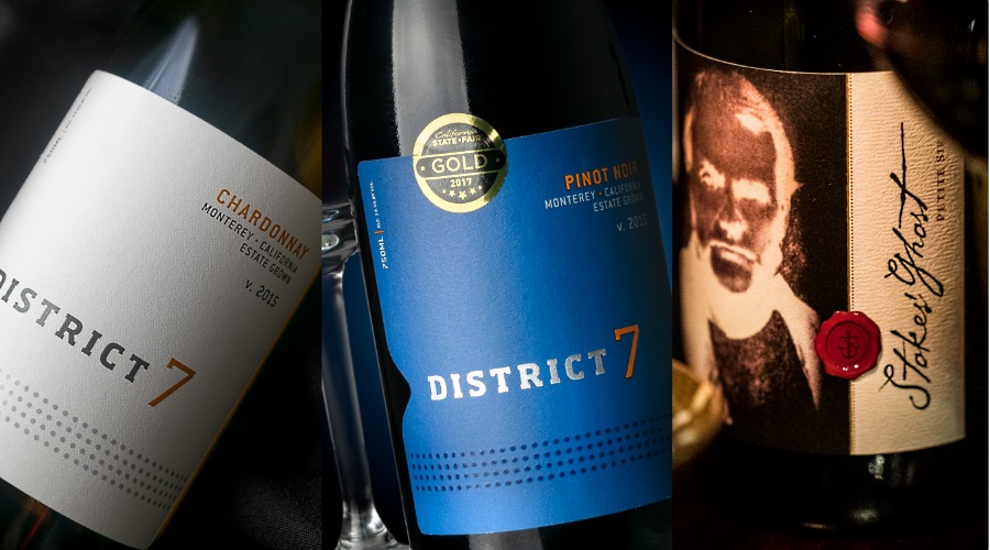 de 3 vinerna för kvällen: District 7 Pinot Noir, District 7 Chardonnay och Stokes’ Ghost Petit Sirah